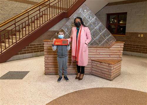 Photo of JoAnna Connell Stairclimber Israel Woodworth and Assistant Principal Deanna McFarland.