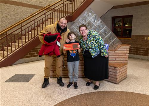 Photo of Lincoln Stairclimber Jordan Pfadt and family member.