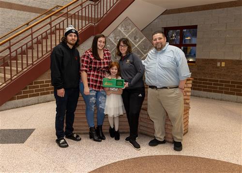 Photo of JoAnna Connell's March Stairclimber, Anessa Cohick, and family. 