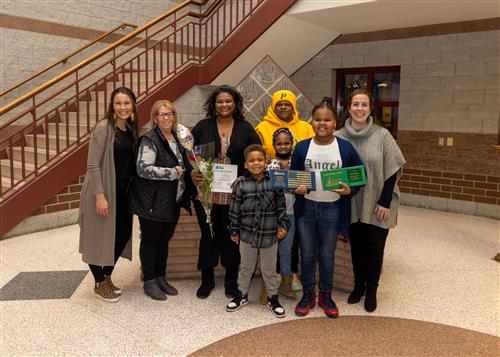 Photo of Edison's March Stairclimber, Tara'ji Barney, and family.