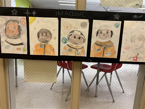 Photo shows a series of five student-drawn pictures of Mae Jemison, the first African-American woman in space.