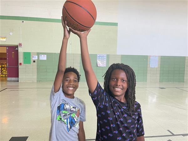 Grover Cleveland students practicing basketball in sports-based summer program