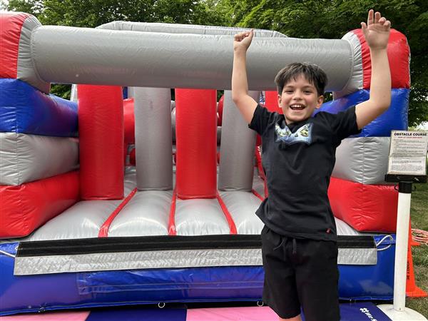 Edison students enjoy a bounce house to celebrate the last day of